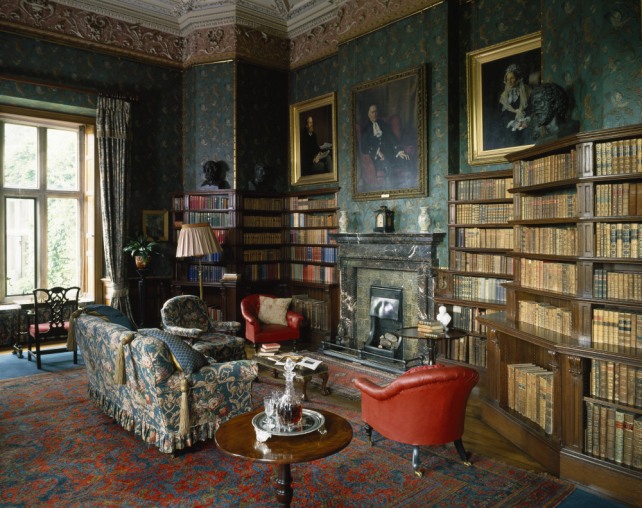 The Library at Dunster Castle, created by Salvin, 1870 - 1871. The nineteenth century wallpaper simulated embossed leather, and is known as Cordelova.